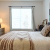 a bed with a large window