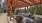 outdoor lounge area under a wooden cabana